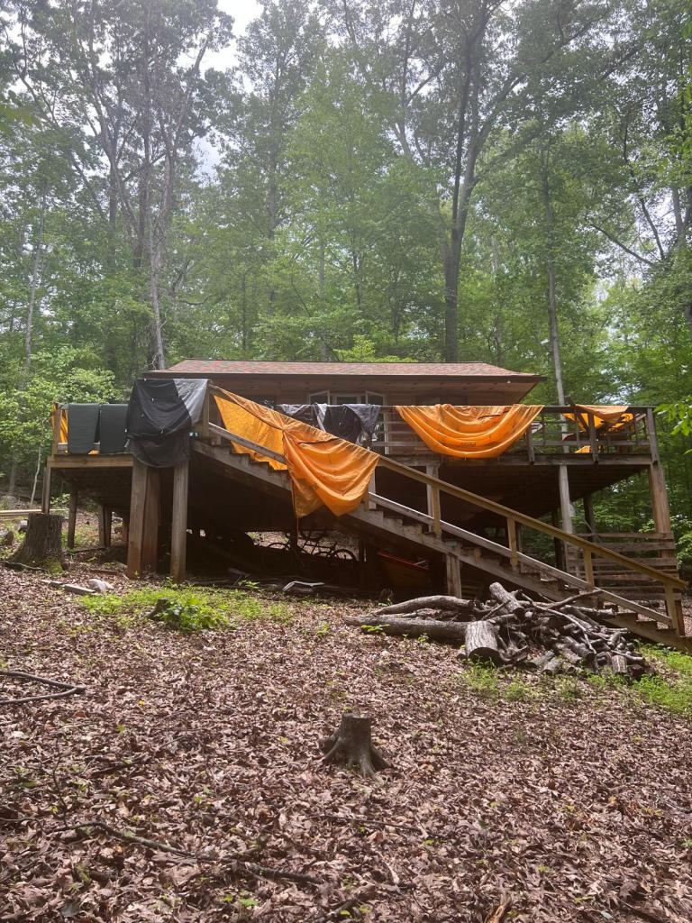 Our tents and sleeping pads being dried outside the cabin
