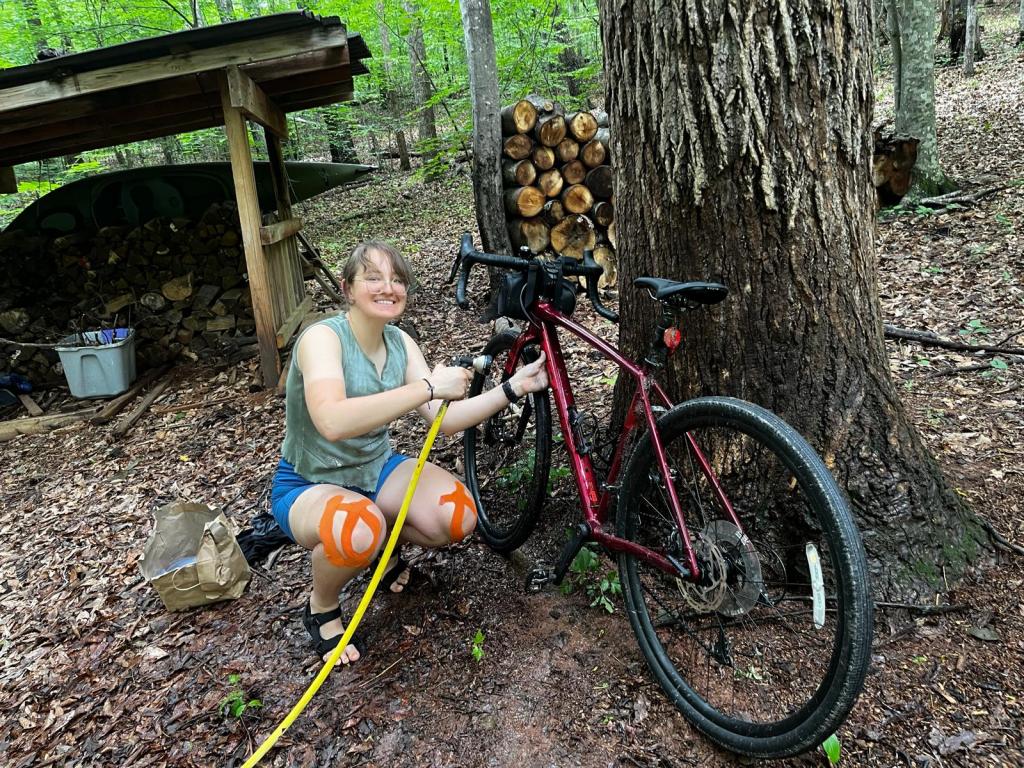 Ramona hosing down a dirty bike